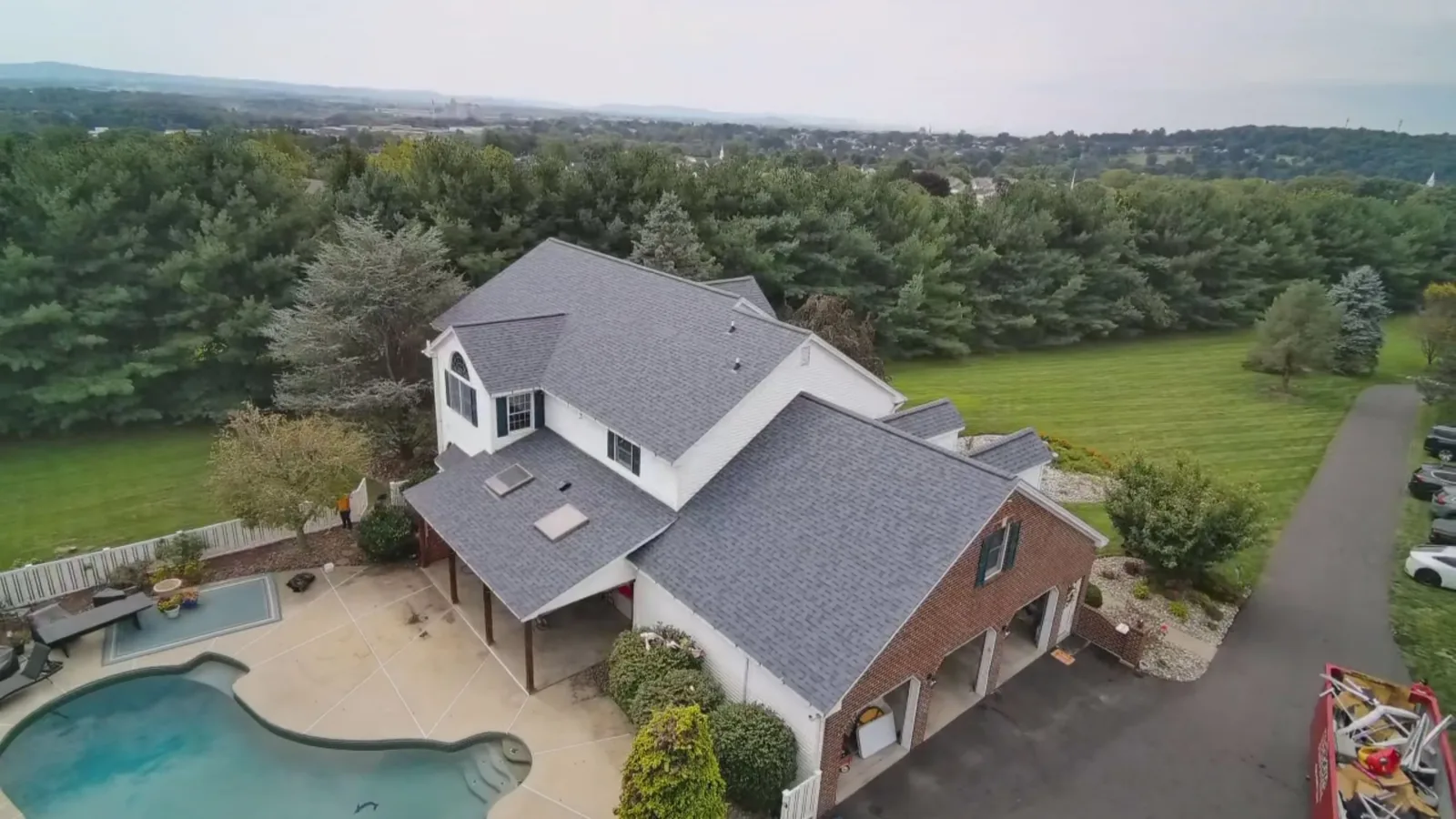 Aerial view of a completed Owens Corning Duration Harbor Blue shingle roof on a hilltop home overlooking the Lehigh Valley in Nazareth, PA by LV Roofing & Siding