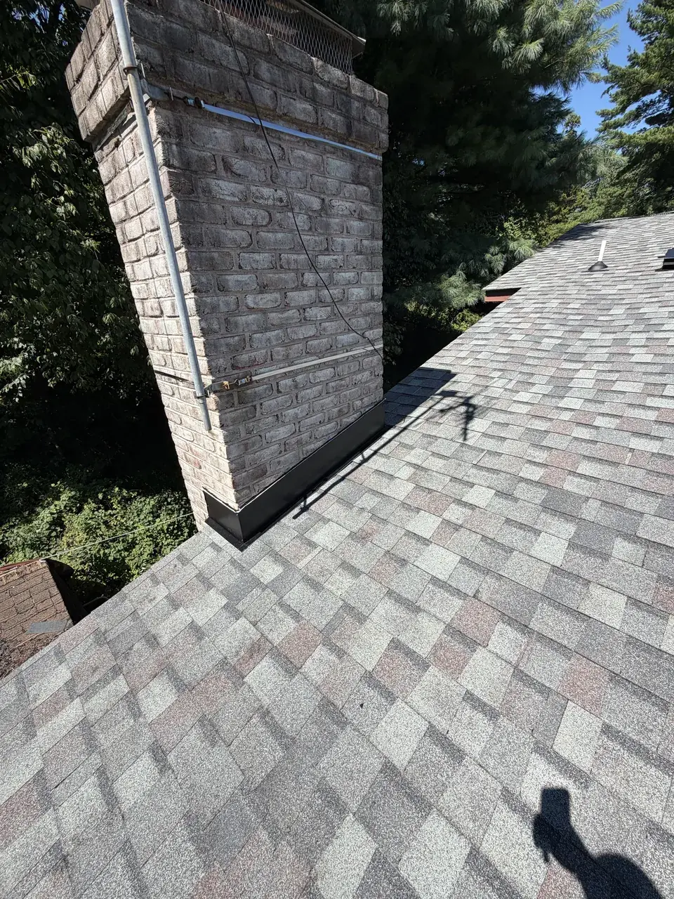 New chimney flashing on a roof replacement in Reading, PA by LV Roofing